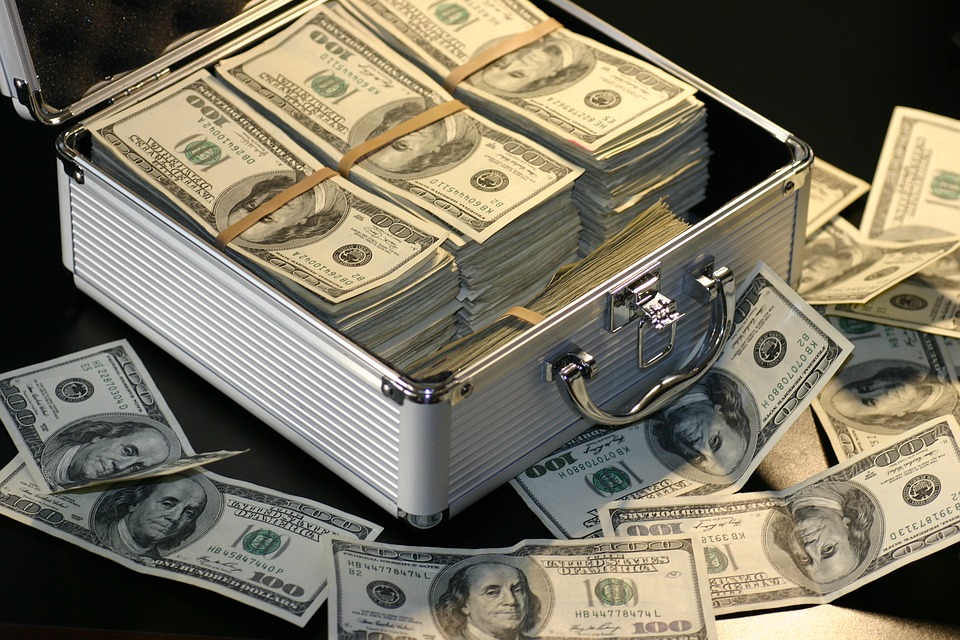 Automotive key management systems can save thousands - Image of briefcase full of 100 dollar bills